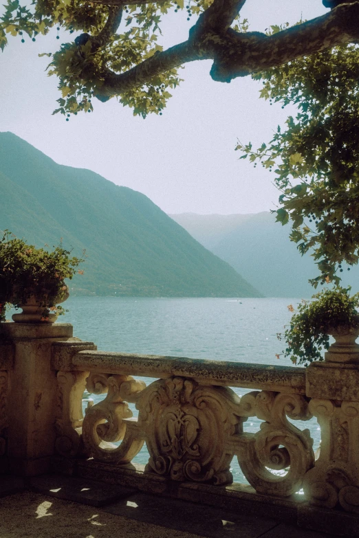 the stone bench overlooks a body of water