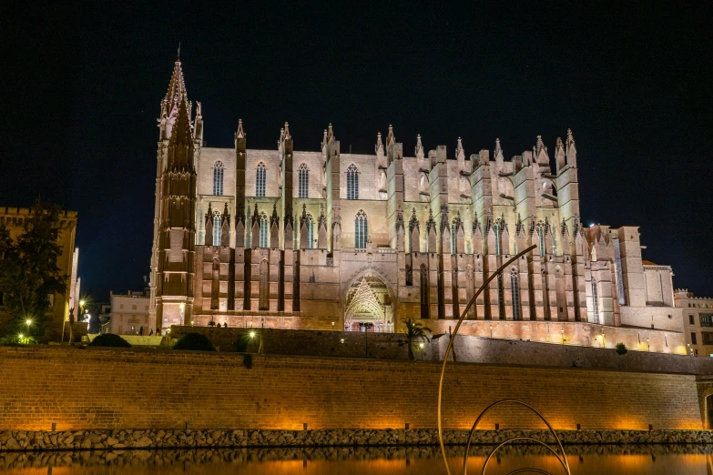 a large building with two towers and many windows in front of it