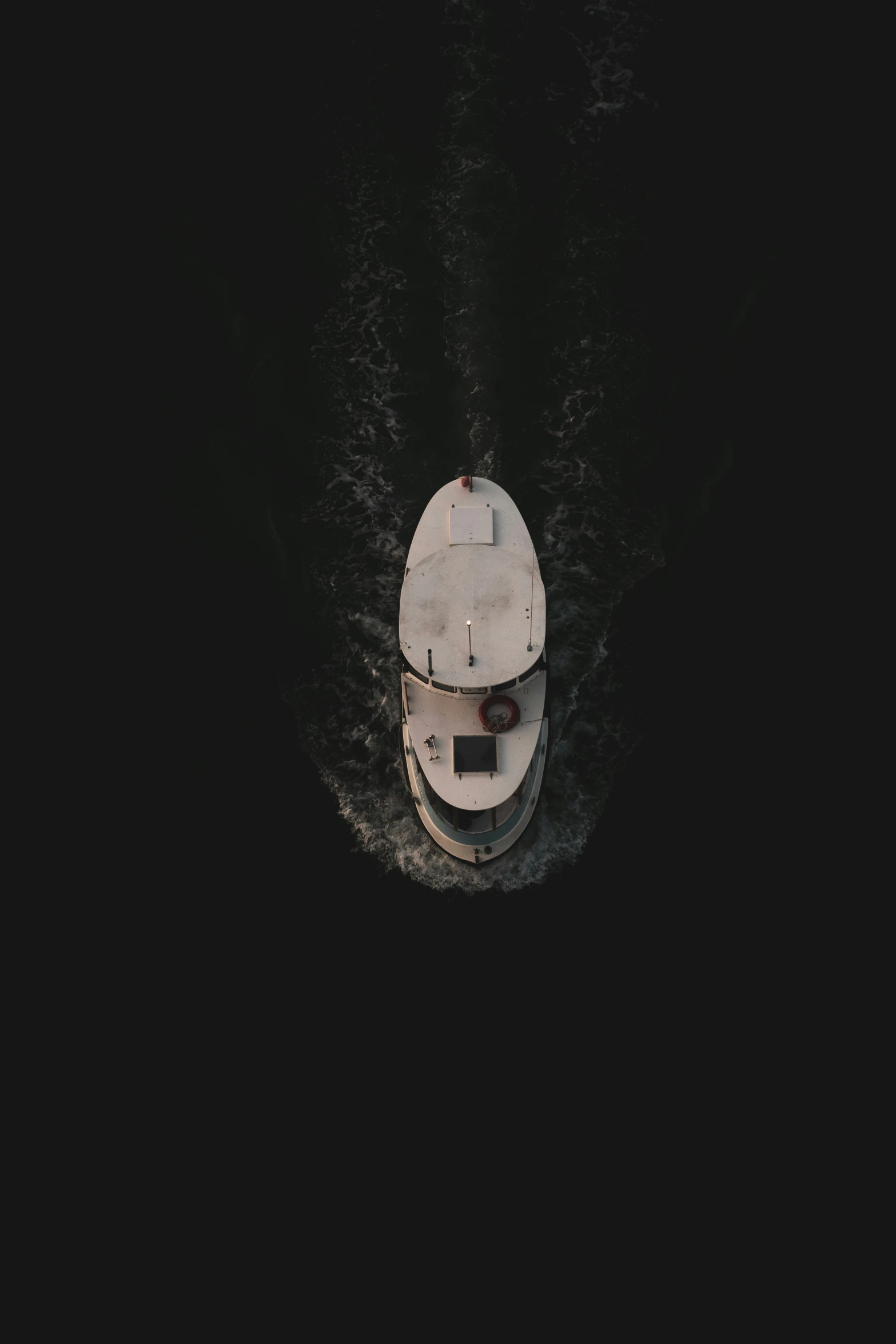 a view from above looking down on a boat in the water