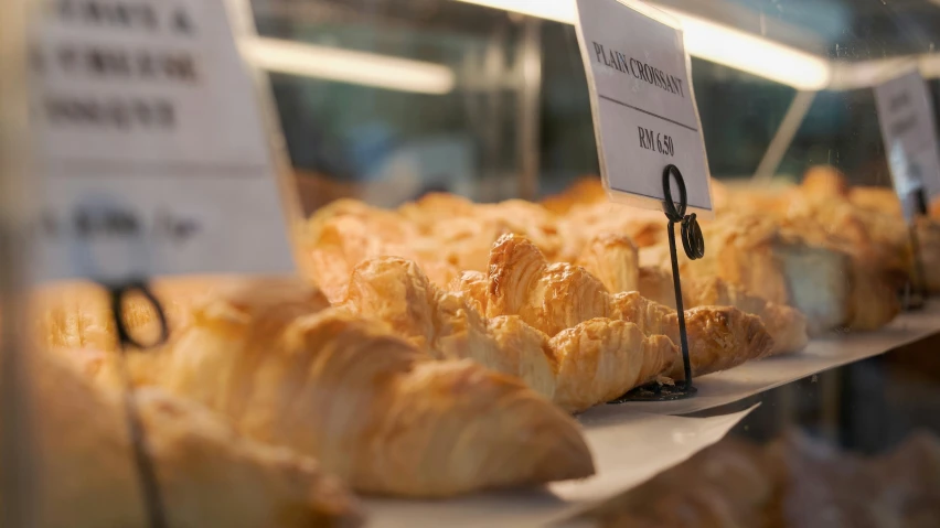 baked items are sitting on a table in a store