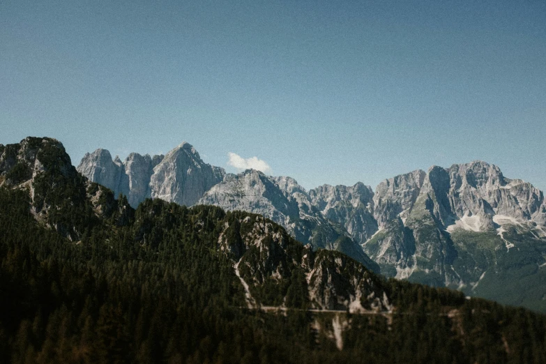 a picture of the mountain side from near the water