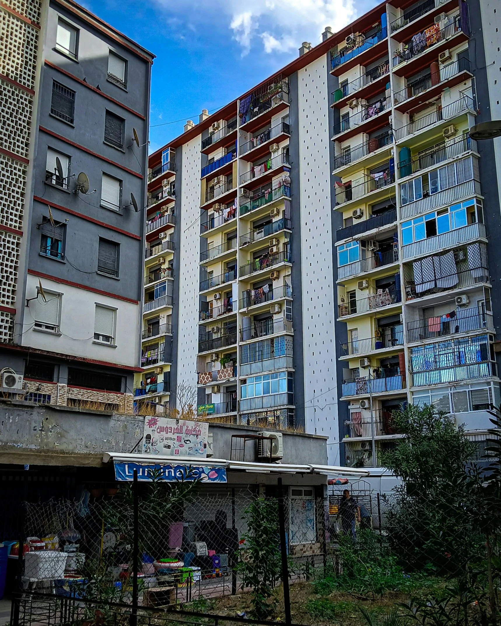 a large building on top of an overpass and another building below it