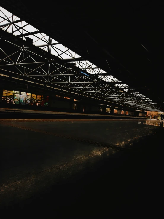 a black and white pograph of an empty train platform