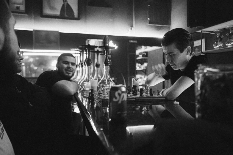 a man is at a bar, being served his drink