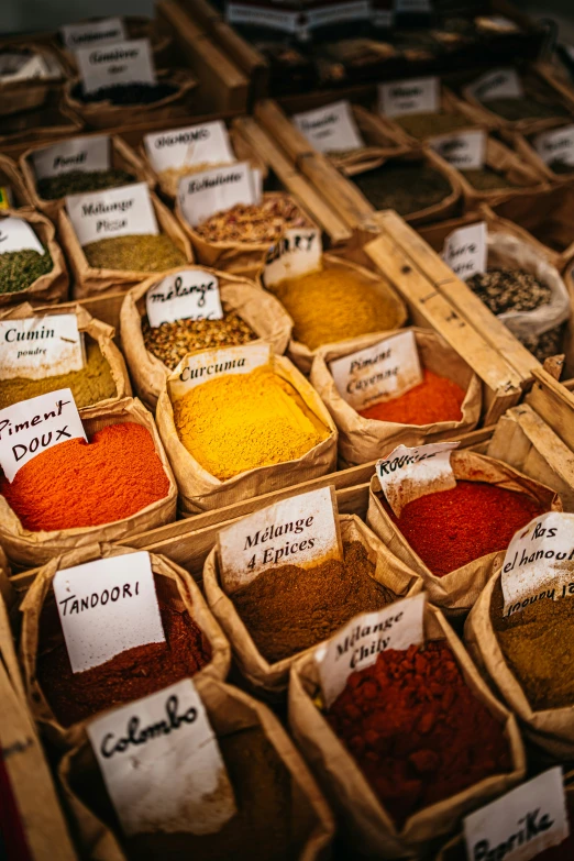 an assortment of spices for sale on a table