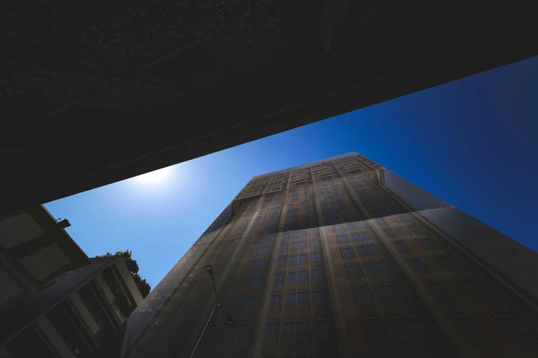 the upward side of a tall building, seen through a window