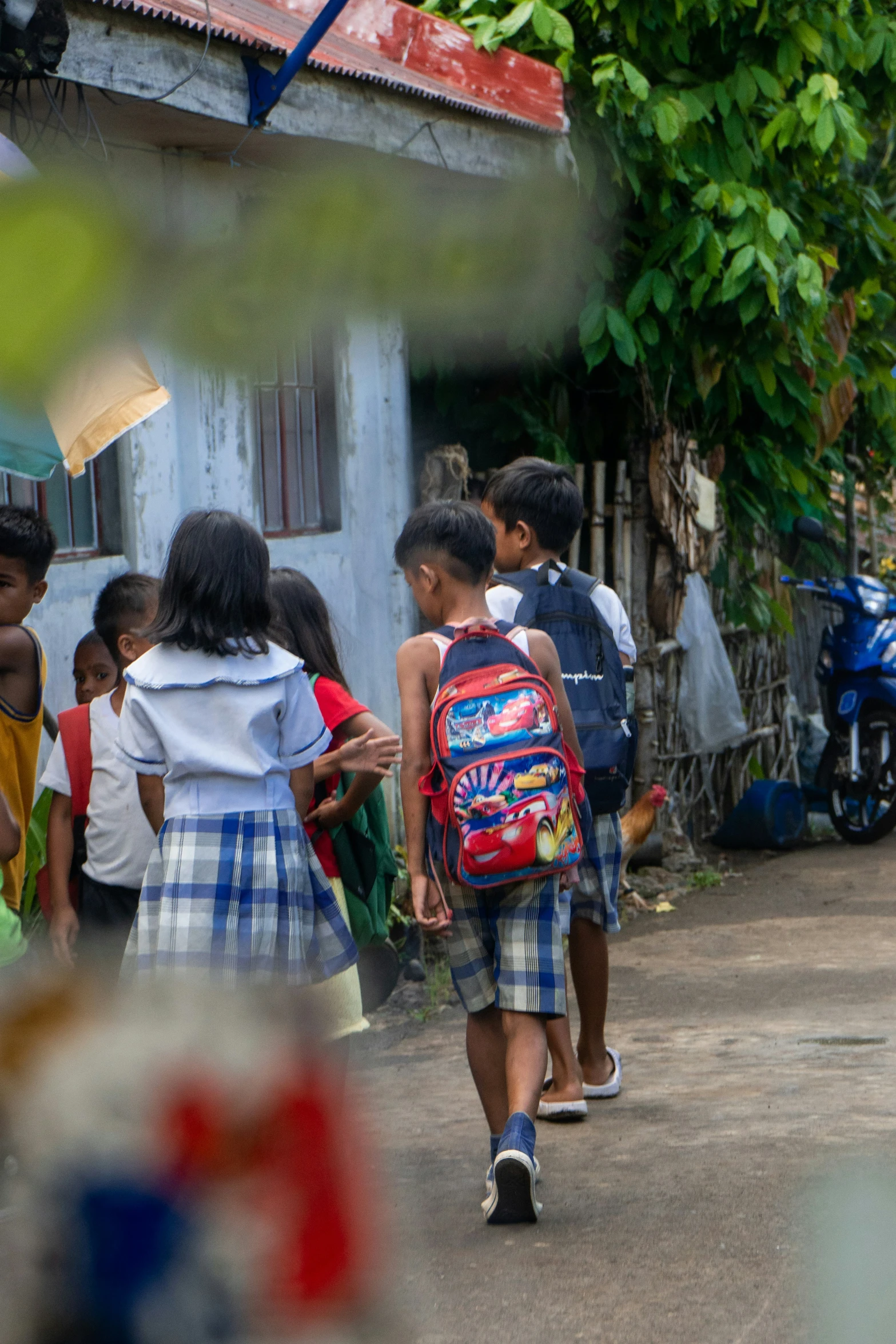 a bunch of people stand in a village area