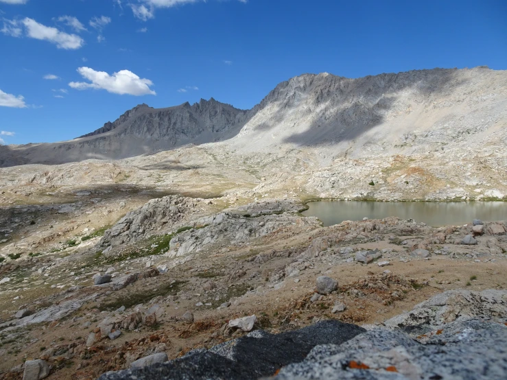 a large mountain sitting on the top of a dry hillside