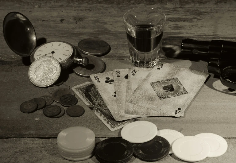 a table topped with two glasses and cards