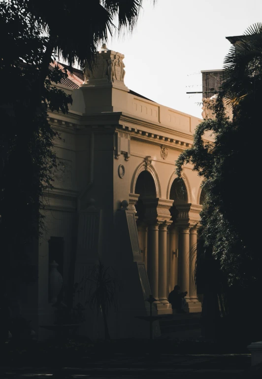 an old building with tall columns and arched windows