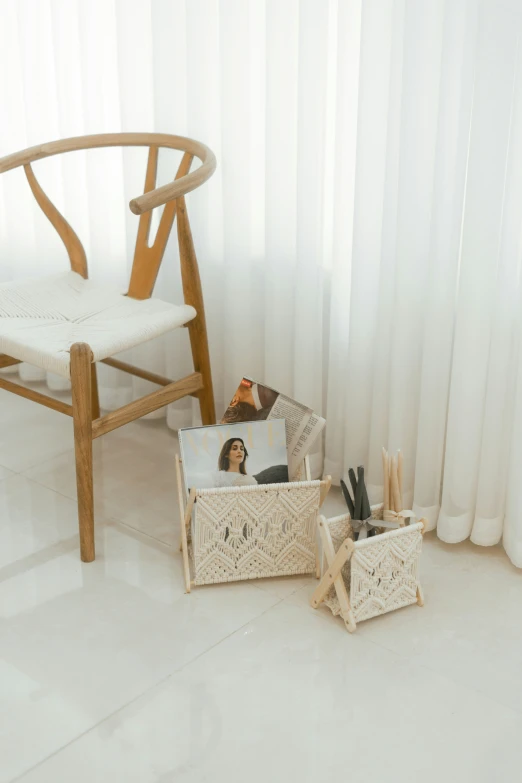 two wooden chairs and baskets with pens and pencils in them