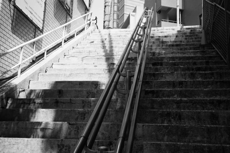 a black and white po of a stairwell with a handrail