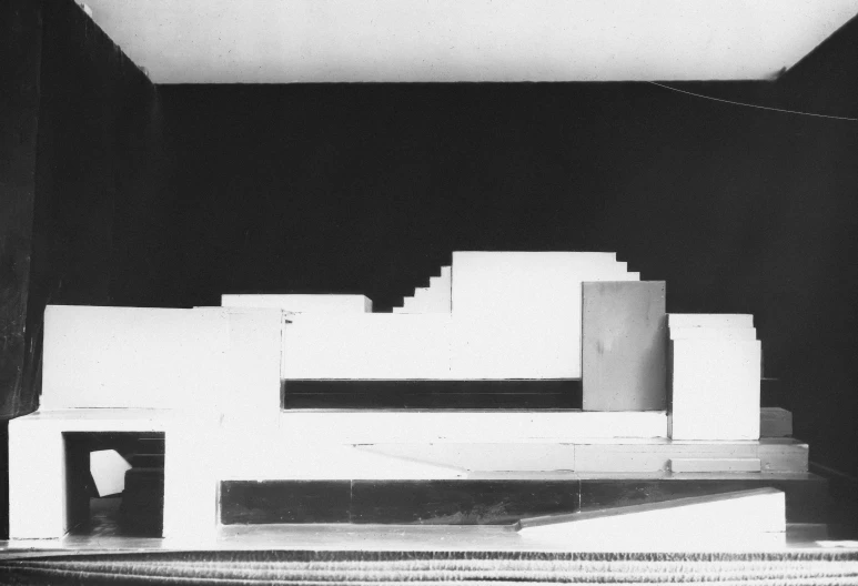 a model of the building with two people standing in the doorway