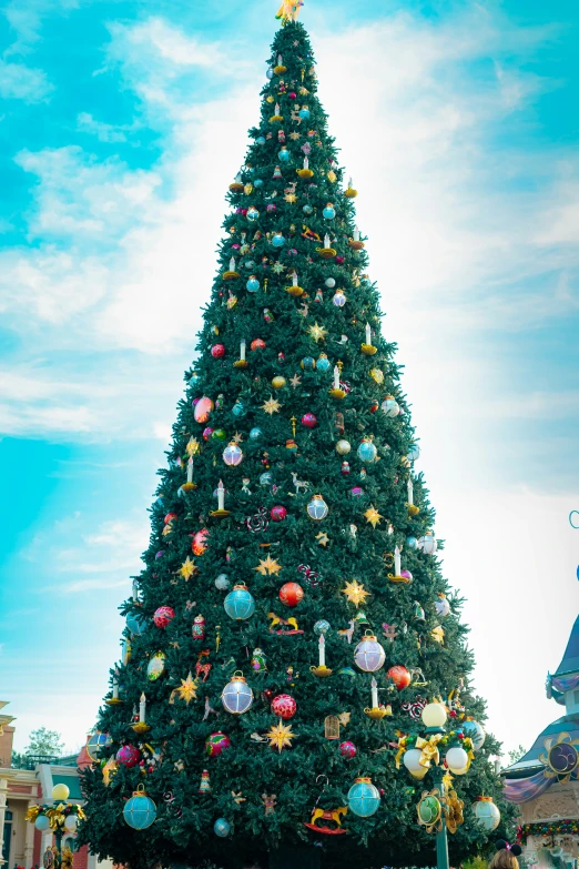 a large christmas tree surrounded by other christmas decorations