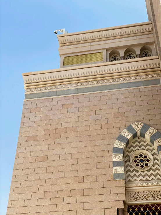 the corner of a building with a fancy decorative window