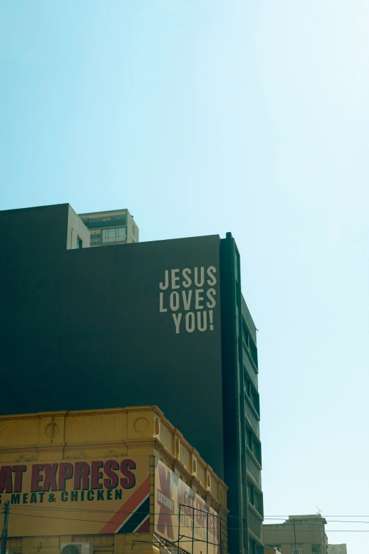 a billboard for jesus loves you with the words jesus loves you written on it