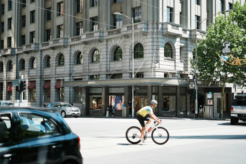 a person is riding their bike on the street