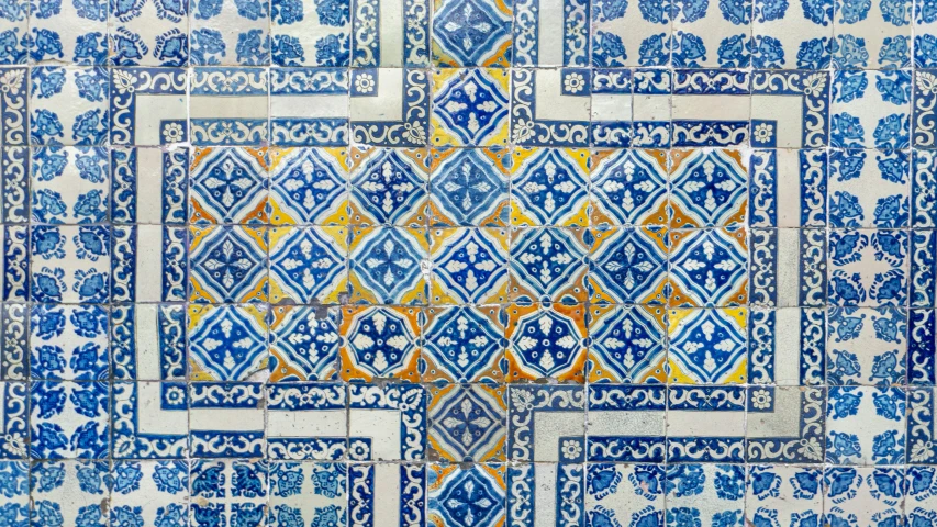 ornate tile patterns painted in blue and yellow