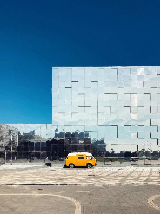 a building with a small bus parked near it