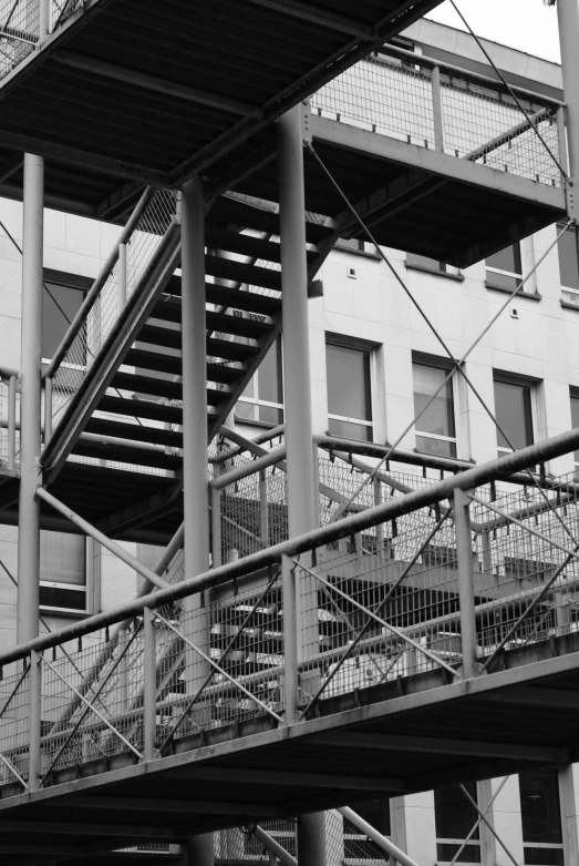 a building with stairs and a fire escape from it