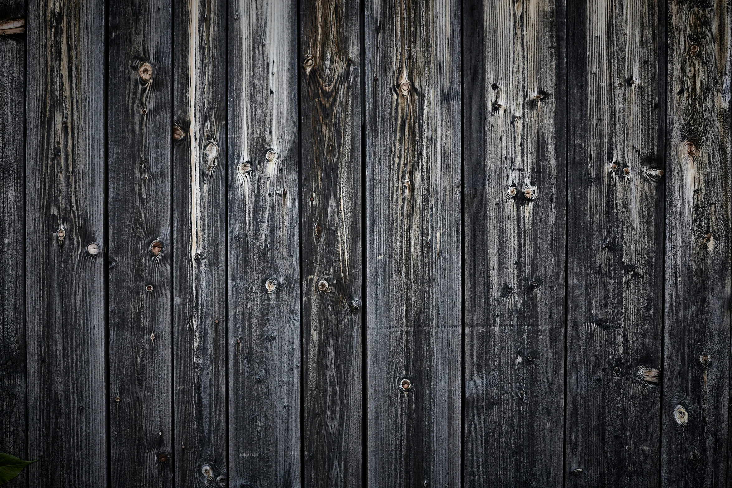 an image of a black textured wood background