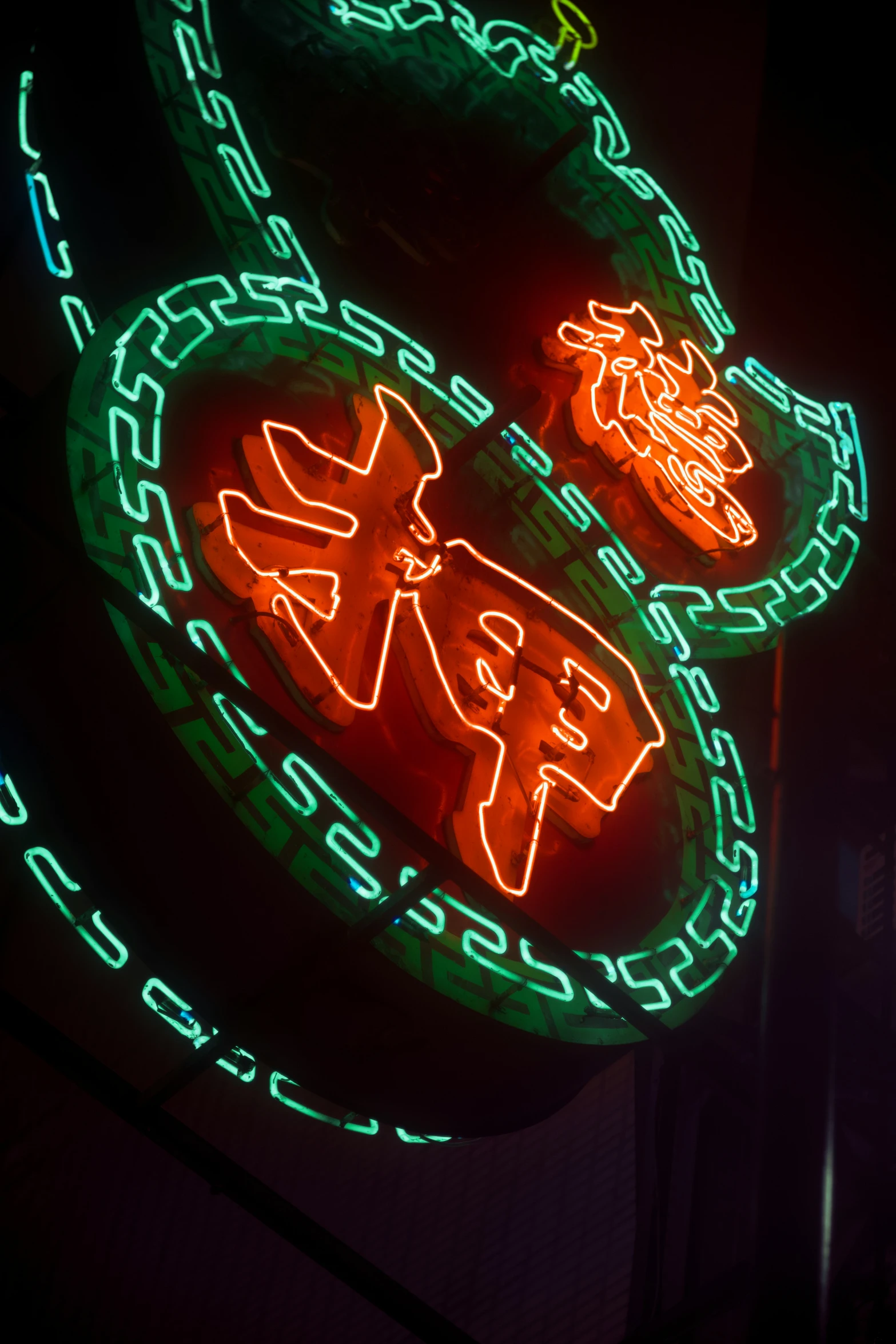 neon signs displayed on the side of a building