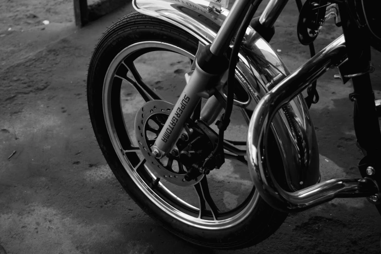 closeup view of the back tire and spokes on a motorcycle