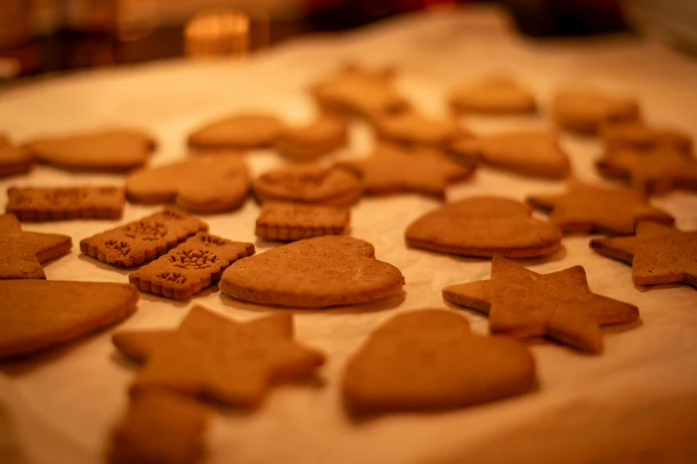 a lot of cookies are arranged on top of a sheet