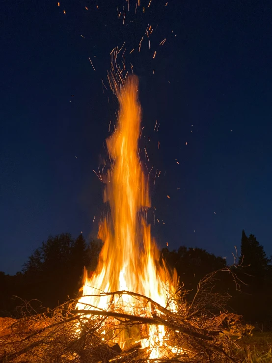 a bonfire is on its side and its blazing in the air