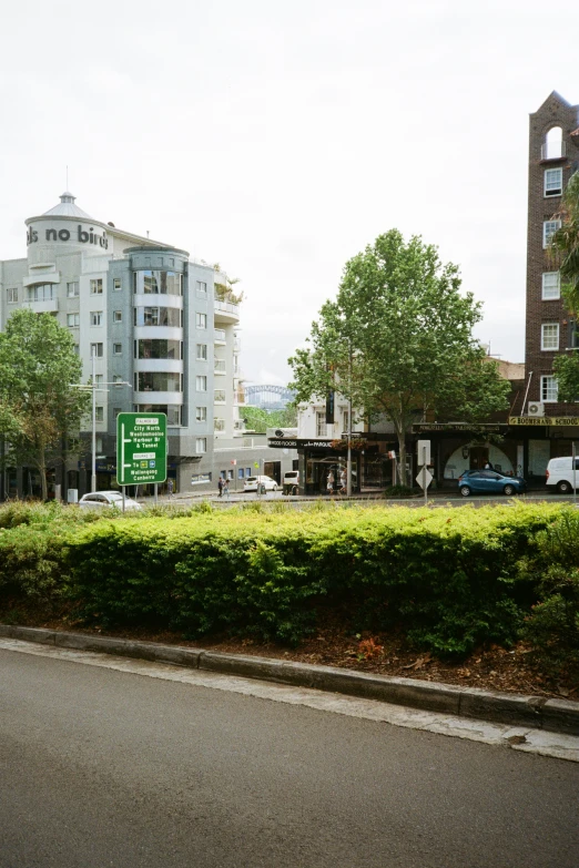 a green grassy area in front of a building