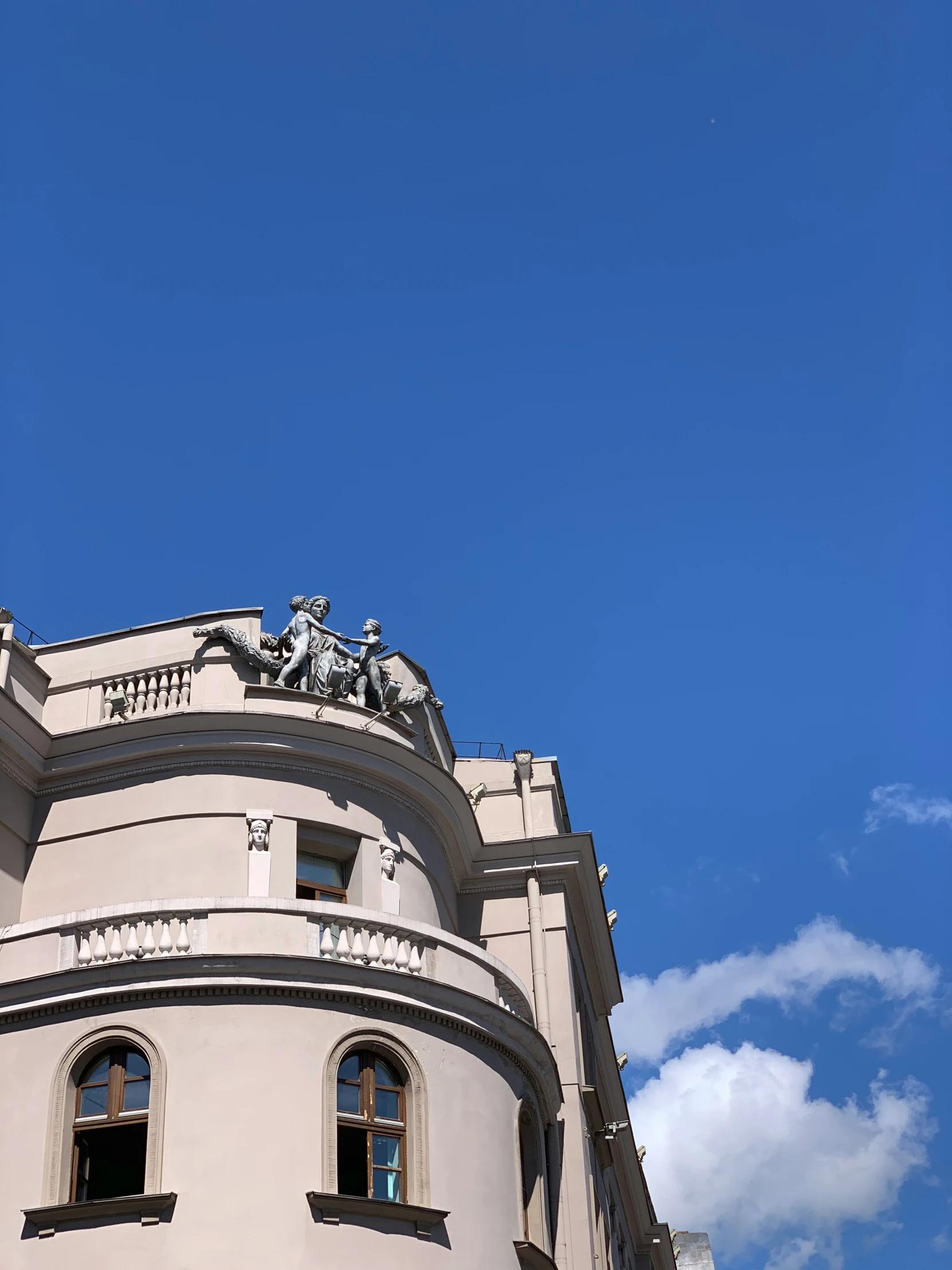 there is a building that looks like it has statues on top of it