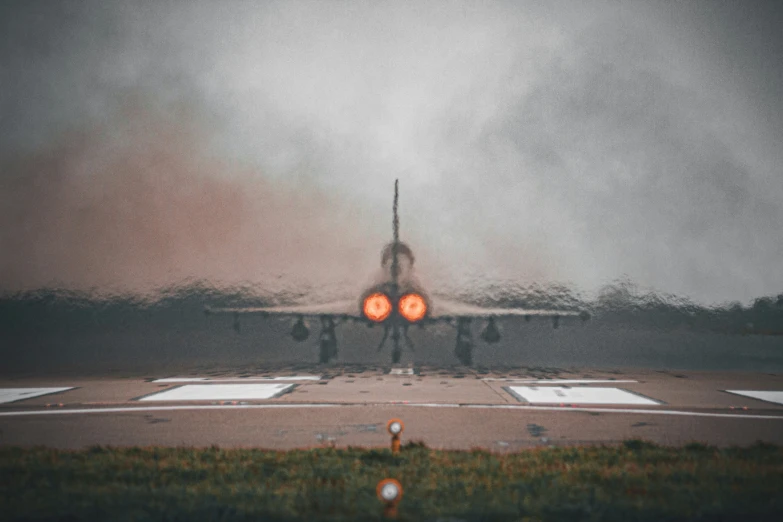 an airplane is seen from behind a light