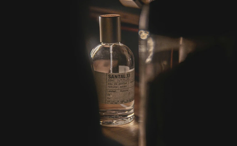 a bottle of tanning oil is shown in the dark