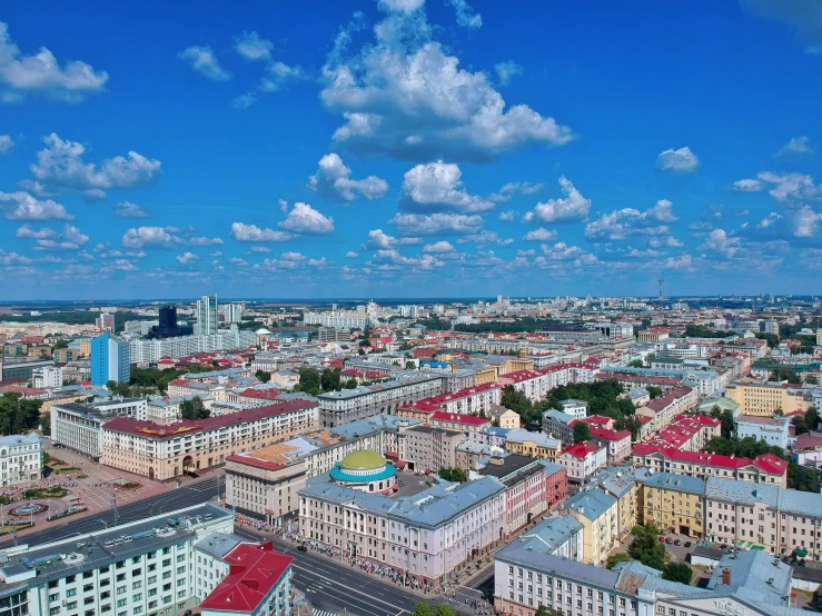 a city with tall buildings sitting under a blue sky