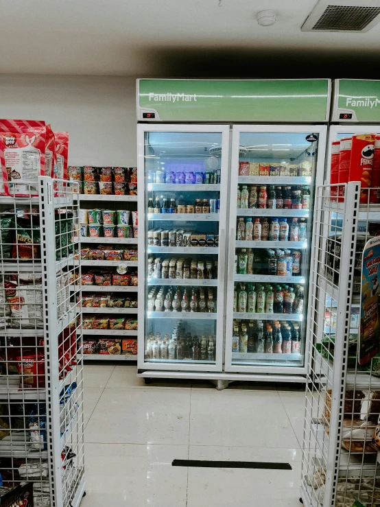 two coolers filled with drinks and beverages next to each other