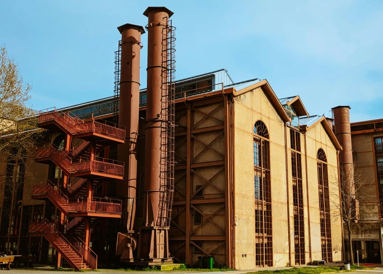 an old industrial style building with lots of pipes