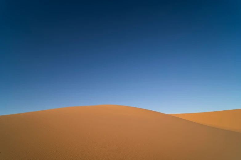 a person walking through the desert by himself