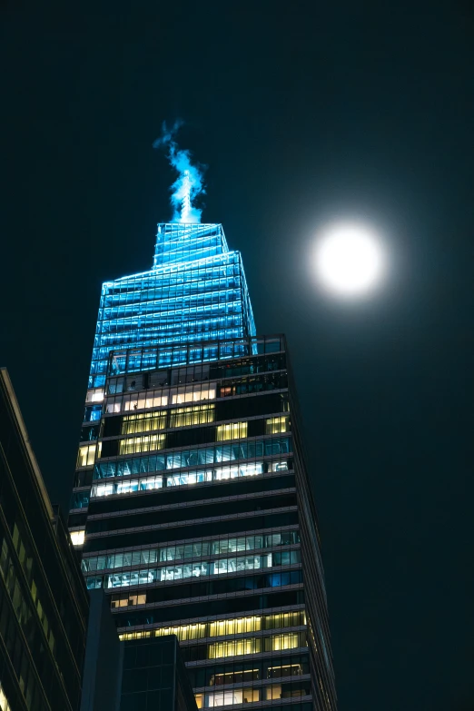 a tall building lit up in the night