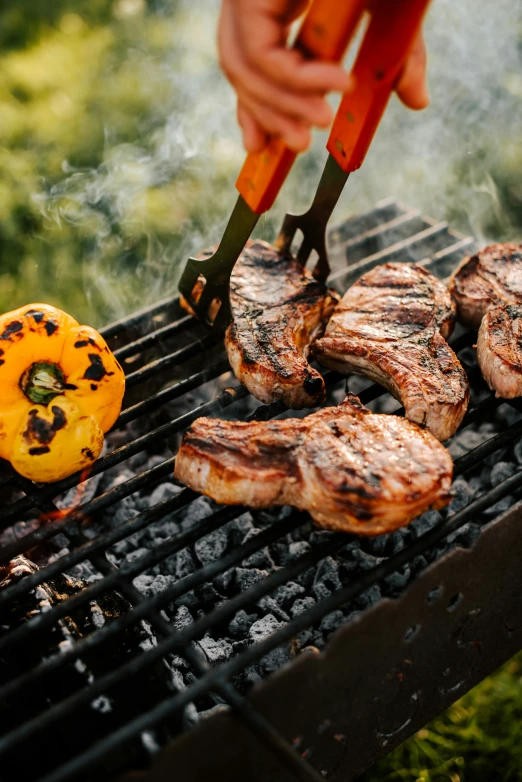 the large steak is being prepared on the grill