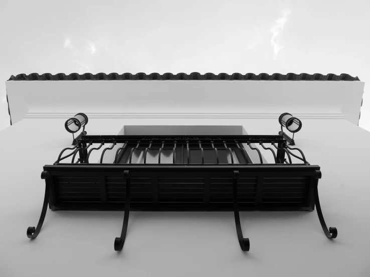 a grill and some sort of iron on a metal table