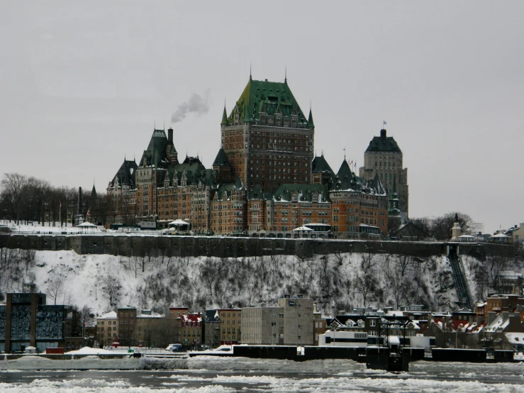 a very big pretty building with a lot of snow on it