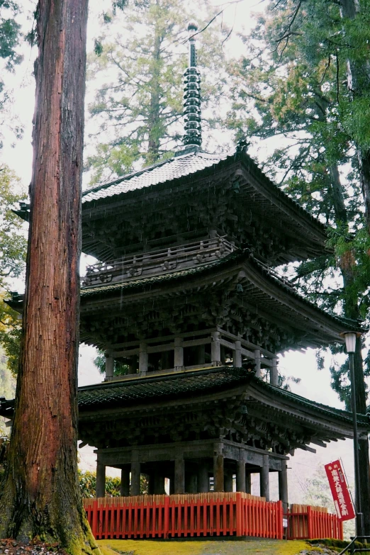 an old structure in the middle of a forest