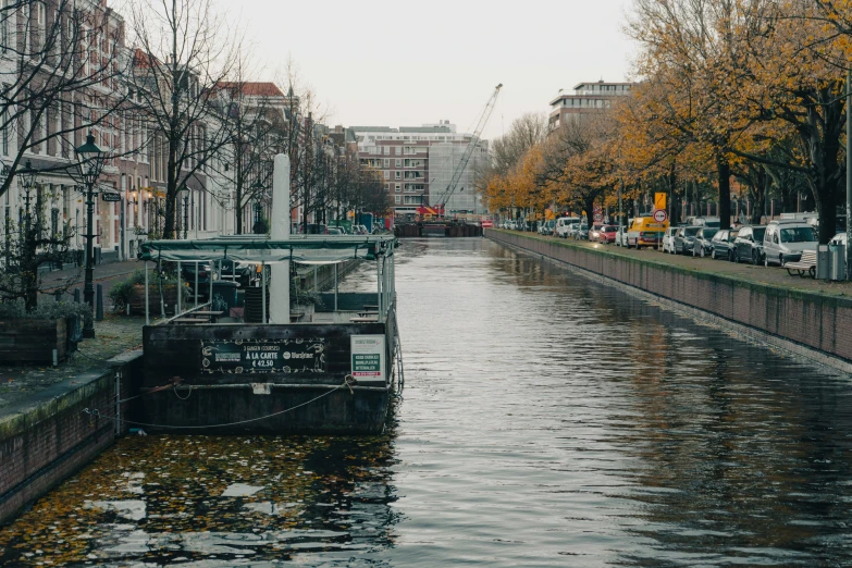 a waterway surrounded by tall buildings and trees