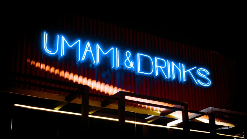 a large neon sign that is on the side of a building