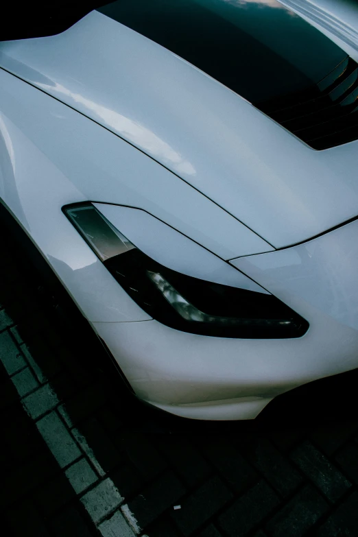 white sport car sits on the ground