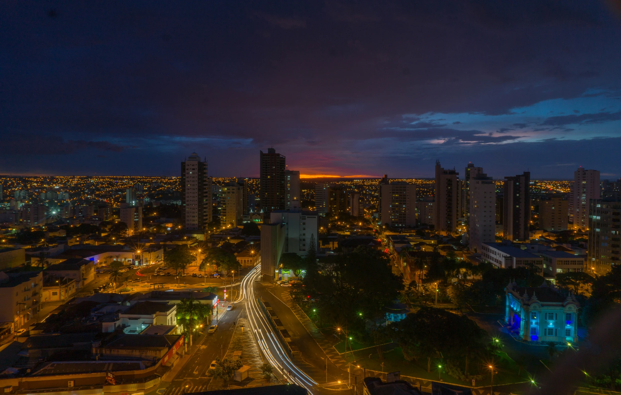 a night view of a city with many buildings