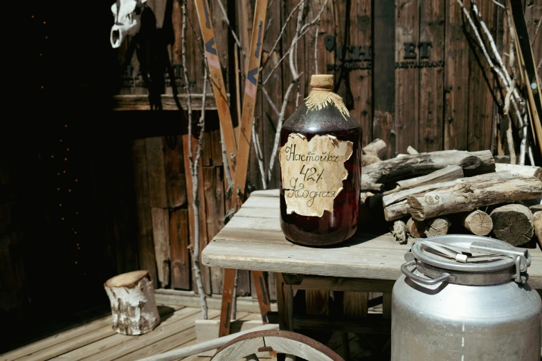 there is a jug on the table with a lot of wood