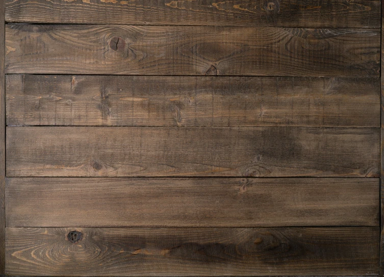 a brown wooden background texture with scratches on it