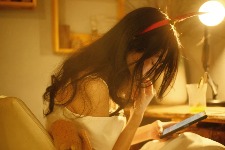 a girl laying on a bed with a laptop