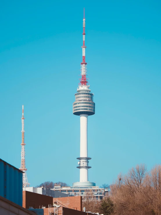 a tall tower on top of a building next to trees